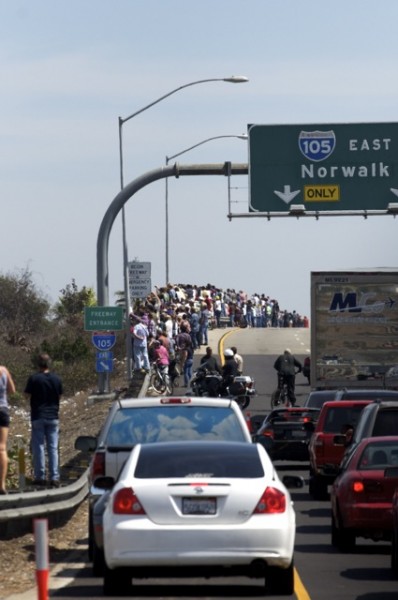 Huge crowd of people lining the edge of the 105 freeway Huge crowd of people lining the edge of the 105 freeway
