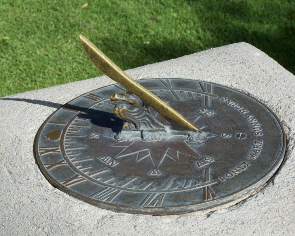 There's a sundial at the back of the courtyard that you can use to try to figure out the time.