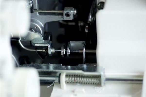 After the thread is sucked into the machine, it's perfectly threaded underneath the needle