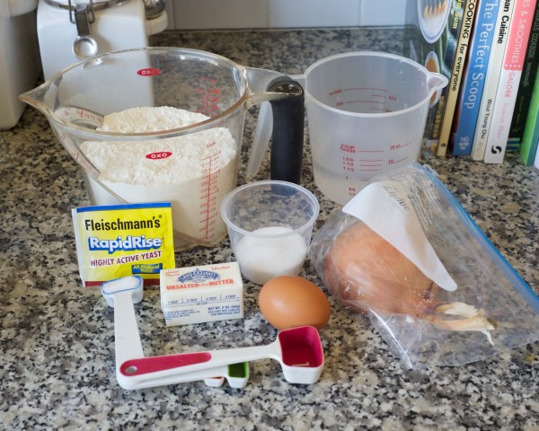 I started with the ingredients: flour, sugar, water, yeast, butter, salt, an egg and an onion